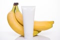 Product branding concept. Photo of fresh bio vitamin facial cleanser with yellow banana extract essence isolated over white
