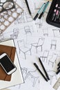 Product designers desk with design sketches and drawing instruments Royalty Free Stock Photo