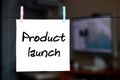 Product launch. Note is written on a white sticker that hangs wi