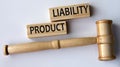 PRODUCT LIABILITY - words on wooden blocks on a white background with a judge\'s gavel