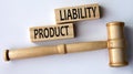 PRODUCT LIABILITY - words on wooden blocks on a white background with a judge\'s gavel