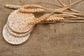 Product made from wheat, expanded and ears wheat on o jute background. Healthy organic food. Selectiv focus. Copy space