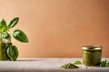 Product packaging mockup photo of Jar of pesto sauce, studio advertising photoshoot