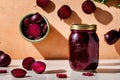 Product packaging mockup photo of jar of pickled beets, studio advertising photoshoot