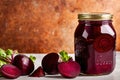 Product packaging mockup photo of jar of pickled beets, studio advertising photoshoot