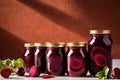 Product packaging mockup photo of jar of pickled beets, studio advertising photoshoot