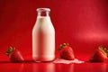 Product packaging mockup photo of Milk or yogurt in a bottle red strawberry. , studio advertising photoshoot Royalty Free Stock Photo