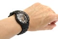 A product photo taken on a black wrist watch worn around a wrist Royalty Free Stock Photo