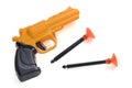 A yellow black spring suction cup dart toy pistol gun against a white backdrop Royalty Free Stock Photo