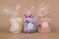 Product photograph of colourful natural wax candles on brown background Royalty Free Stock Photo