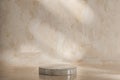 product placement podium. round marble podium is centered on beige backdrop. podium surface boasts natural textures, offering an Royalty Free Stock Photo