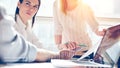 Product presentation. Marketing team at work. Open space loft office. Laptop and paperwork Royalty Free Stock Photo