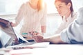 Product researching. Marketing team at work. Open space loft office. Laptop and paperwork. Woman discussing Royalty Free Stock Photo