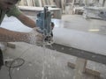 The production of acrylic worktops at a furniture factory. A worker produces acrylic countertops at the factory. A worker polishes