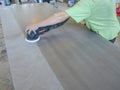 The production of acrylic worktops at a furniture factory. A worker produces acrylic countertops at the factory. A worker polishes