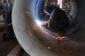 Welding of the inner seam of the shell using semi-automatic weld Royalty Free Stock Photo