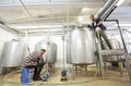 Men working at craft beer brewery kettles Royalty Free Stock Photo