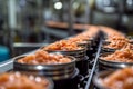 Production of canned fish. Tin cans of fish on the conveyor Royalty Free Stock Photo