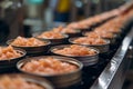 Production of canned fish. Tin cans of fish on the conveyor Royalty Free Stock Photo