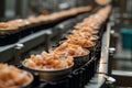 Production of canned fish. Tin cans of fish on the conveyor Royalty Free Stock Photo