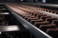 Production of chocolates at the factory, conveyor. Generative AI.