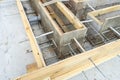 Production of the concrete base under the house with use of a removable timbering. Royalty Free Stock Photo