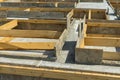 Production of the concrete base under the house with use of a removable timbering. Royalty Free Stock Photo