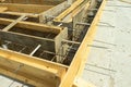 Production of the concrete base under the house with use of a removable timbering. Royalty Free Stock Photo