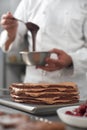 The work of a confectioner, making a cake. pastry chef in white uniform while working in a pastry shop. restaurant Royalty Free Stock Photo