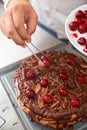 The work of a confectioner, making a cake. pastry chef in white uniform while working in a pastry shop. restaurant Royalty Free Stock Photo