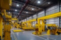 Production hall with large yellow presses for stamping automobile body parts, overhead crane on the ceiling of the hall