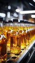 Production line fills glass bottles with vibrant apple and pineapple juice beverages