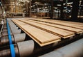 Production line of the wooden floor factory. CNC automatic woodworking machine. Royalty Free Stock Photo