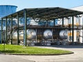 Production of liquefied carbon dioxide of carbonic acid part of chemical plant three cryogenic tanks with CO2 under canopy that