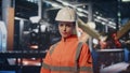 Production operator standing facility manufactory. Portrait of woman engineer