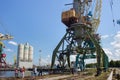 KALININGRAD, RUSSIA - JUNE 19, 2016: Heavy harbour jib cranes in the Kaliningrad Sea Fishing Port. Royalty Free Stock Photo