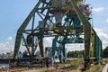KALININGRAD, RUSSIA - JUNE 19, 2016: Heavy harbour jib cranes in the Kaliningrad Sea Fishing Port. Royalty Free Stock Photo