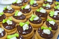 Production of pralines at confectionary factory. Food industral cake line - conveyor belt with sweets