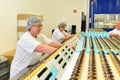 Production of pralines in a factory for the food industry - women working on the assembly line Royalty Free Stock Photo