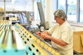 Production of pralines in a factory for the food industry - women working on the assembly line