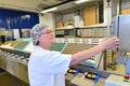 Production of pralines in a factory for the food industry - women working on the assembly line