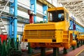 Production process of heavy mining trucks at the factory. Dump truck on the Industrial conveyor in the workshop Royalty Free Stock Photo