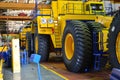 Production process of heavy mining trucks at the factory. Dump truck on the Industrial conveyor in the workshop Royalty Free Stock Photo