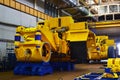 Production process of heavy mining trucks at the factory. Dump truck on the Industrial conveyor in the workshop Royalty Free Stock Photo