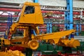 Production process of heavy mining trucks at the factory. Dump truck on the Industrial conveyor in the workshop of an automobile Royalty Free Stock Photo