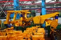 Production process of heavy mining trucks at the factory. Dump truck on the Industrial conveyor in the workshop of an automobile Royalty Free Stock Photo
