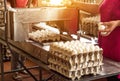 Production for sorting chicken eggs, the process of selection of chicken eggs, close-up, triage