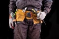 Production worker with tool belt. Worker& x27;s hammer Royalty Free Stock Photo