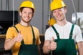 Production workers showing thumbs up sign Royalty Free Stock Photo