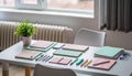 Productive Study Desk with Pastel Notebooks, Stationery, and Plant for Learning and Creative Work Royalty Free Stock Photo